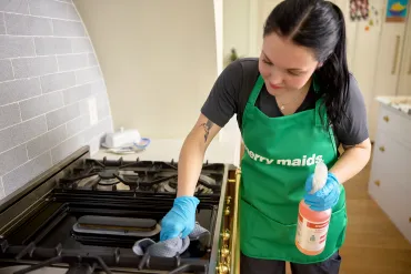merry maid cleaning kitchen stove
